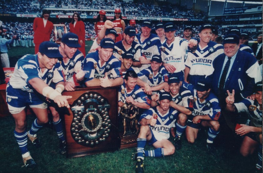 Rod Silva and the 1995 team celebrate winning the Grand Final.