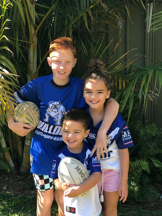 Aiden Tolman's three children - Flynn, Mila and Hudson kitted up in their Bulldogs colours.
