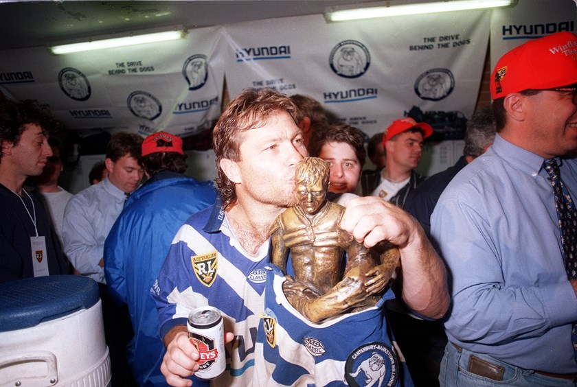 Terry Lamb enjoys a moment with the 1995 premiership trophy.
