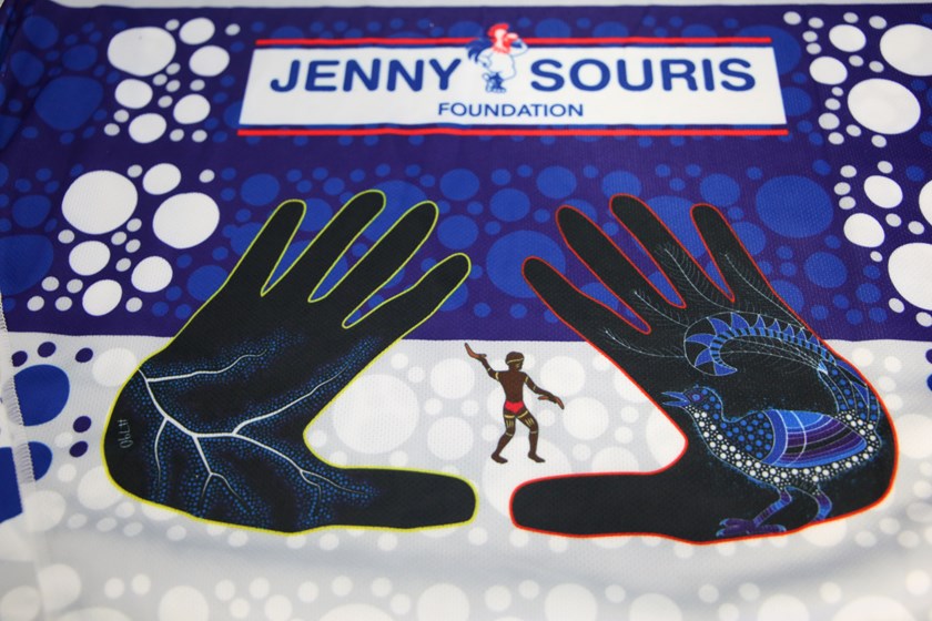 The hands on the back of the jersey represent Adam Elliott and Chris Smith.