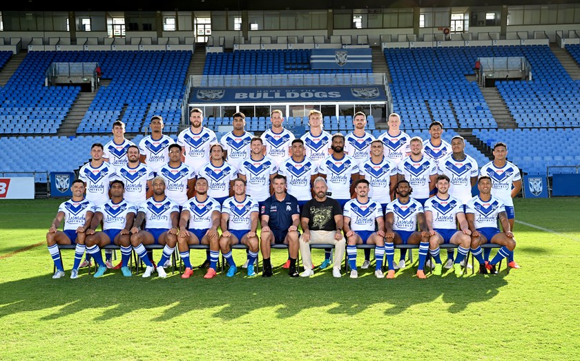 Body Science CMO Nathan Picklum sits in on a team photo with the Bulldogs