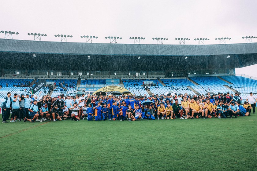 Students, NRL Executives, The Minister for Sport and Bulldogs and Wests Tigers representatives braved the rain for a harmony lap.