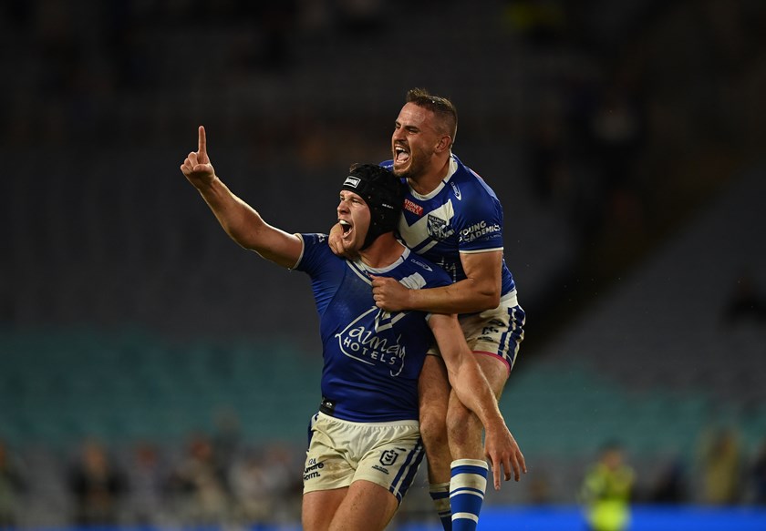 Reynolds celebrates a remarkable 15-14 Round 5 comeback with teammate, Matt Burton.