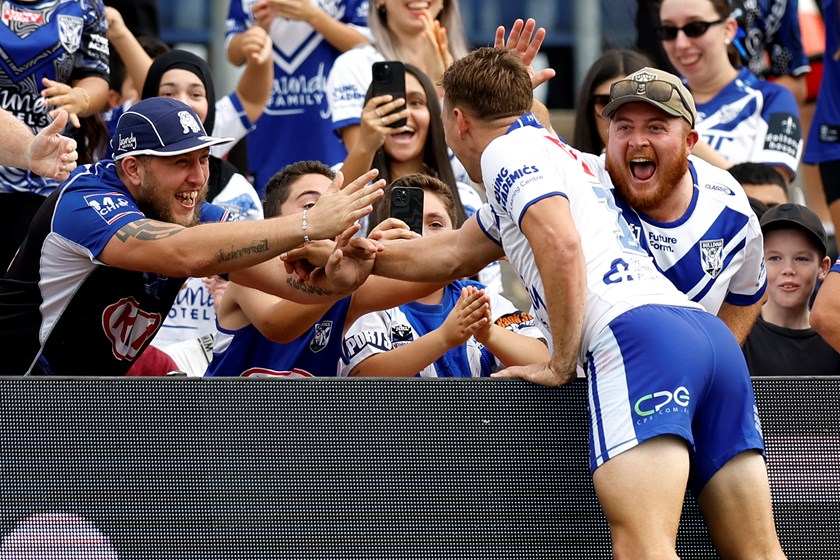 Taaffe celebrates a try with the fans.